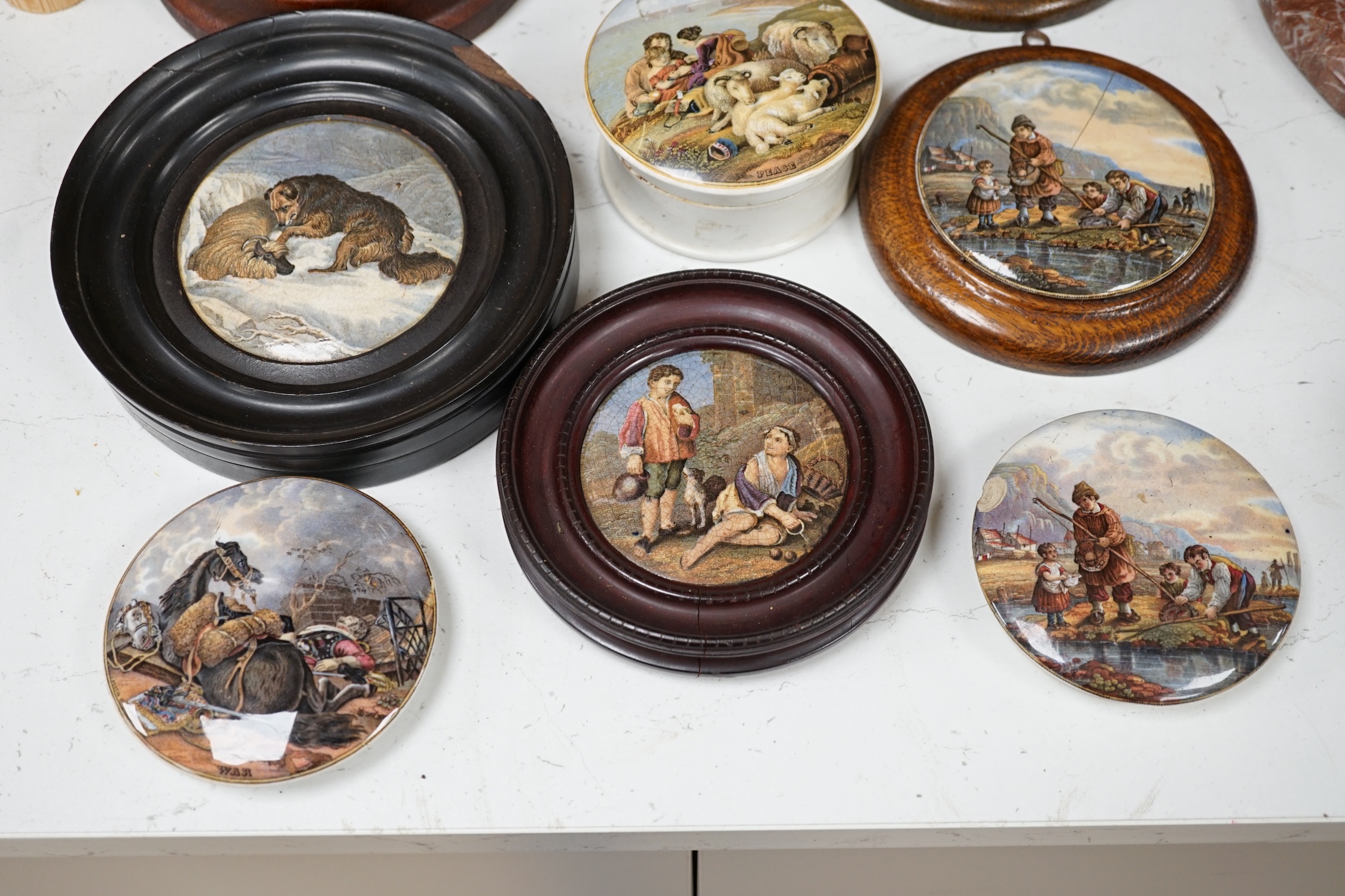 Eleven 19th century mostly framed pot lids including ‘The Snow Drift’, ‘War’, ‘High Life’, etc. Condition - mostly good, one cracked